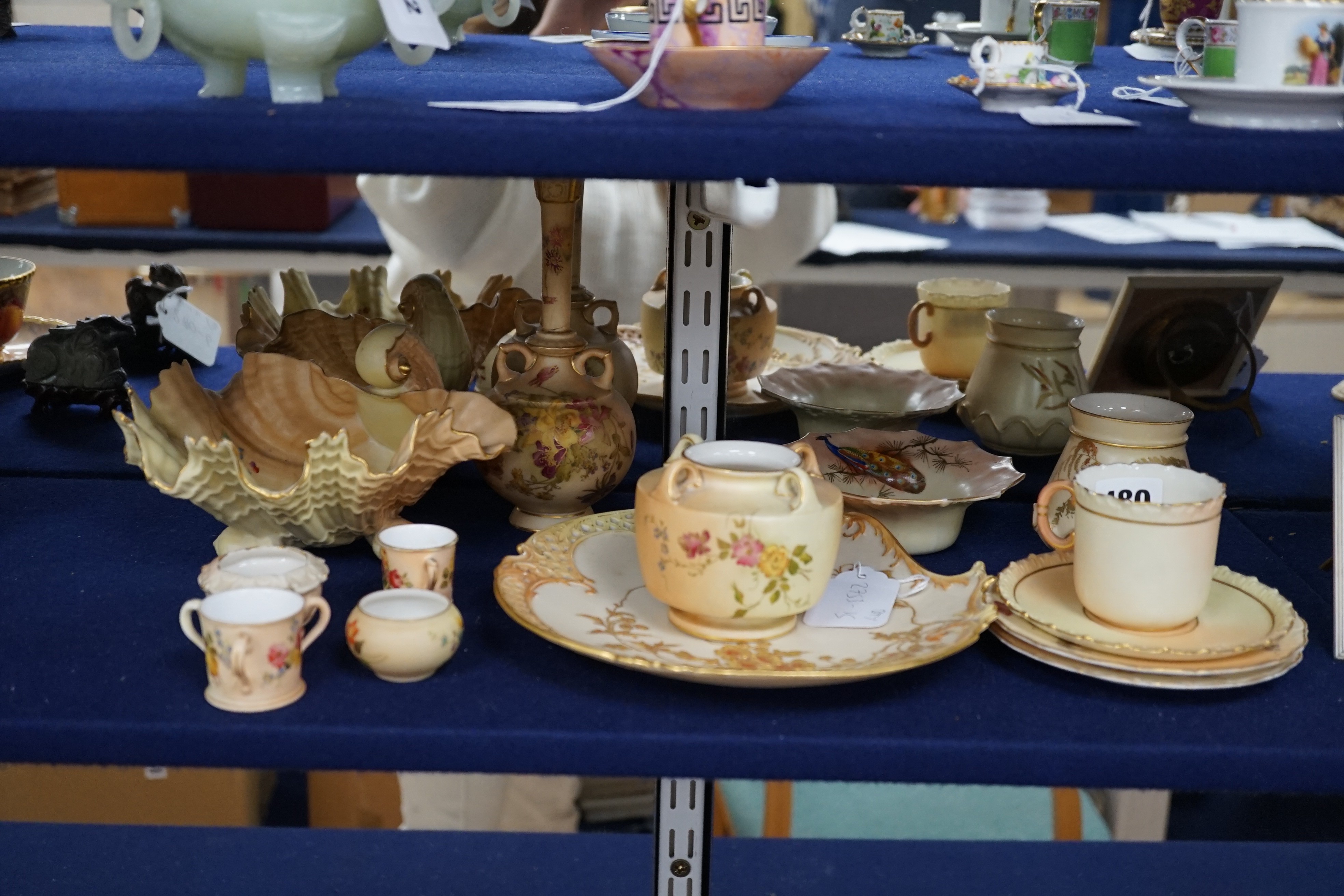 A group of ornamental Royal Worcester blush ivory ground items, including a shell dish, 18cm wide, two vases, a dish etc.